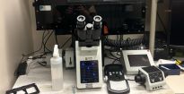 Photo of the IX83 Live Cell microscope with incubator enclosure