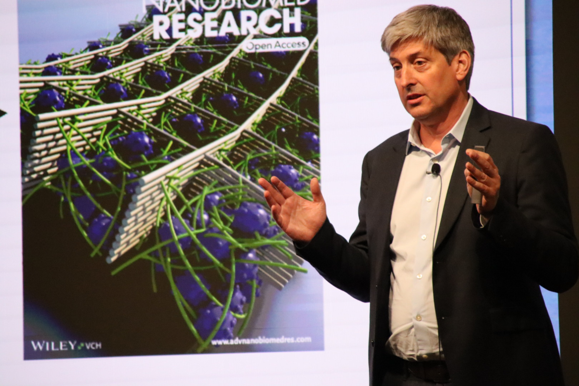 Dr. Joerg Lahann, Director of the Biointerfaces Institute Giving a Research Presentation